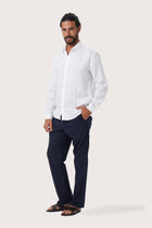 Side profile of the Moreno Linen Shirt White highlighting its easy, breathable fit by By The Sea Bali