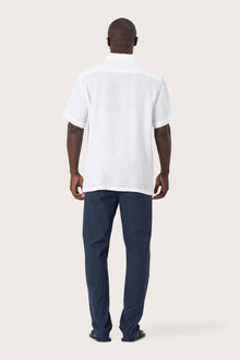 Back view of the Mori Short Sleeve Linen Shirt in White showcasing its tailored finish by By The Sea Bali