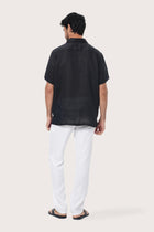 Side profile of the Mori Short Sleeve Linen Shirt in Black highlighting the easy, breathable fit by By The Sea Bali