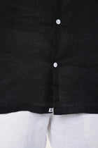 Men's resortwear styling featuring the Mori Short Sleeve Linen Shirt in Black by By The Sea Bali