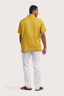 Back view of the Mori Short Sleeve Linen Shirt Gold showcasing its tailored finish by By The Sea Bali
