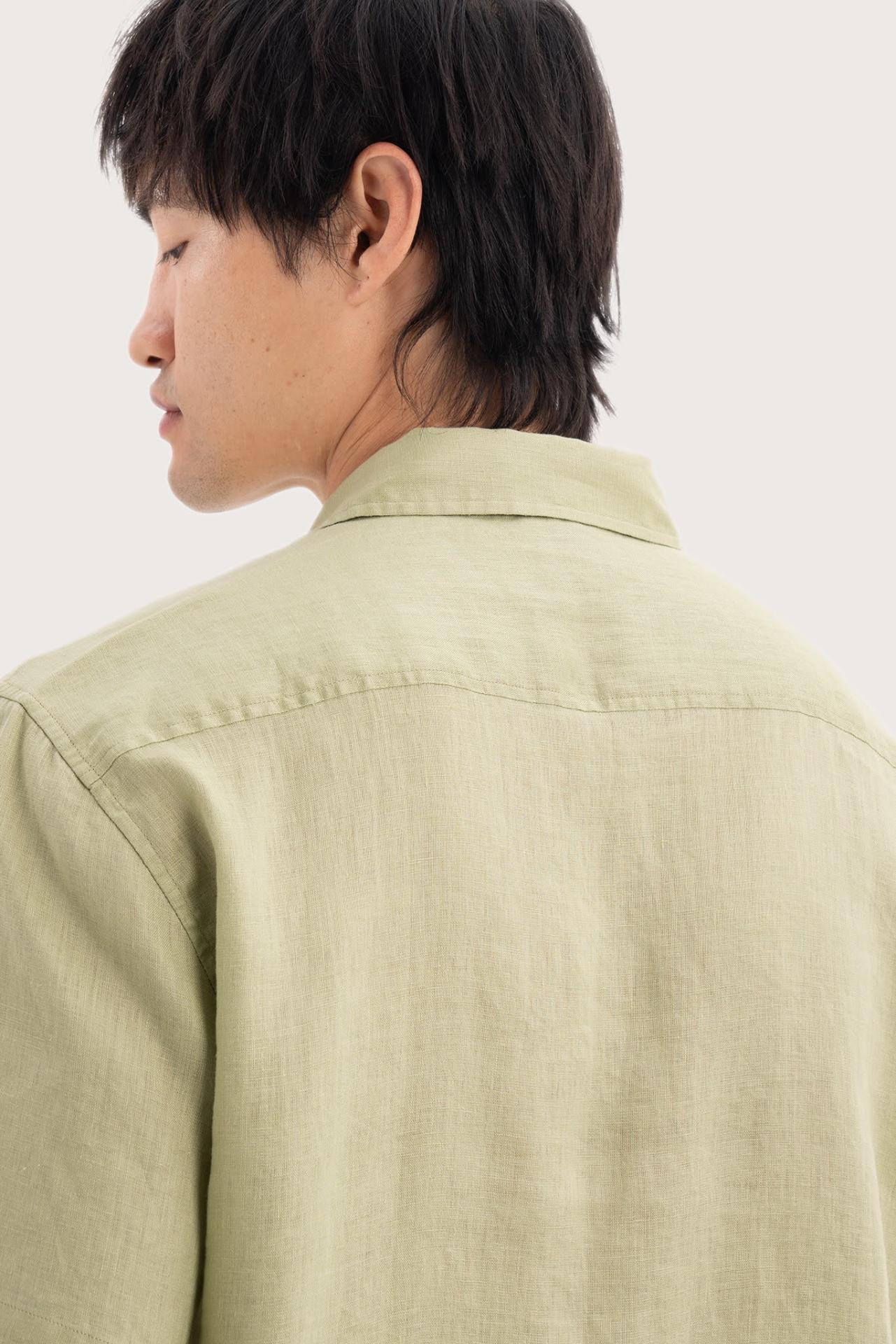 Open collar and button-front detail of the Mori Short Sleeve Linen Shirt Green by By The Sea Bali