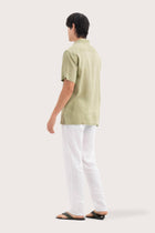 Back view of the Mori Short Sleeve Linen Shirt Green showcasing its tailored finish by By The Sea Bali