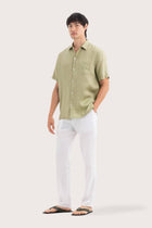 Side profile of the Mori Short Sleeve Linen Shirt Green highlighting its easy, breathable fit by By The Sea Bali