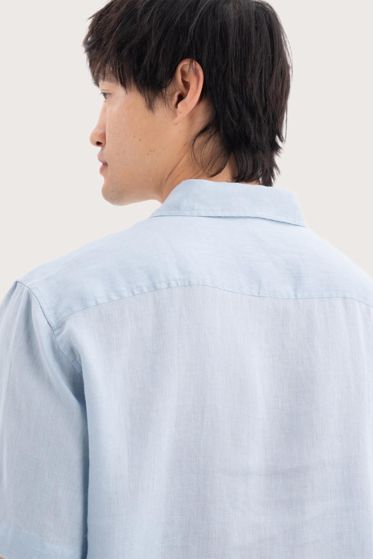 Open collar and button-front detail of the Mori Short Sleeve Linen Shirt Light Blue by By The Sea Bali