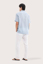 Back view of the Mori Short Sleeve Linen Shirt Light Blue showcasing its tailored finish by By The Sea Bali
