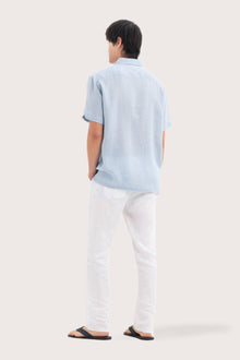 Back view of the Mori Short Sleeve Linen Shirt Light Blue showcasing its tailored finish by By The Sea Bali