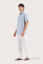 Side profile of the Mori Short Sleeve Linen Shirt Light Blue highlighting its easy, breathable fit by By The Sea Bali