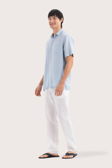 Side profile of the Mori Short Sleeve Linen Shirt Light Blue highlighting its easy, breathable fit by By The Sea Bali