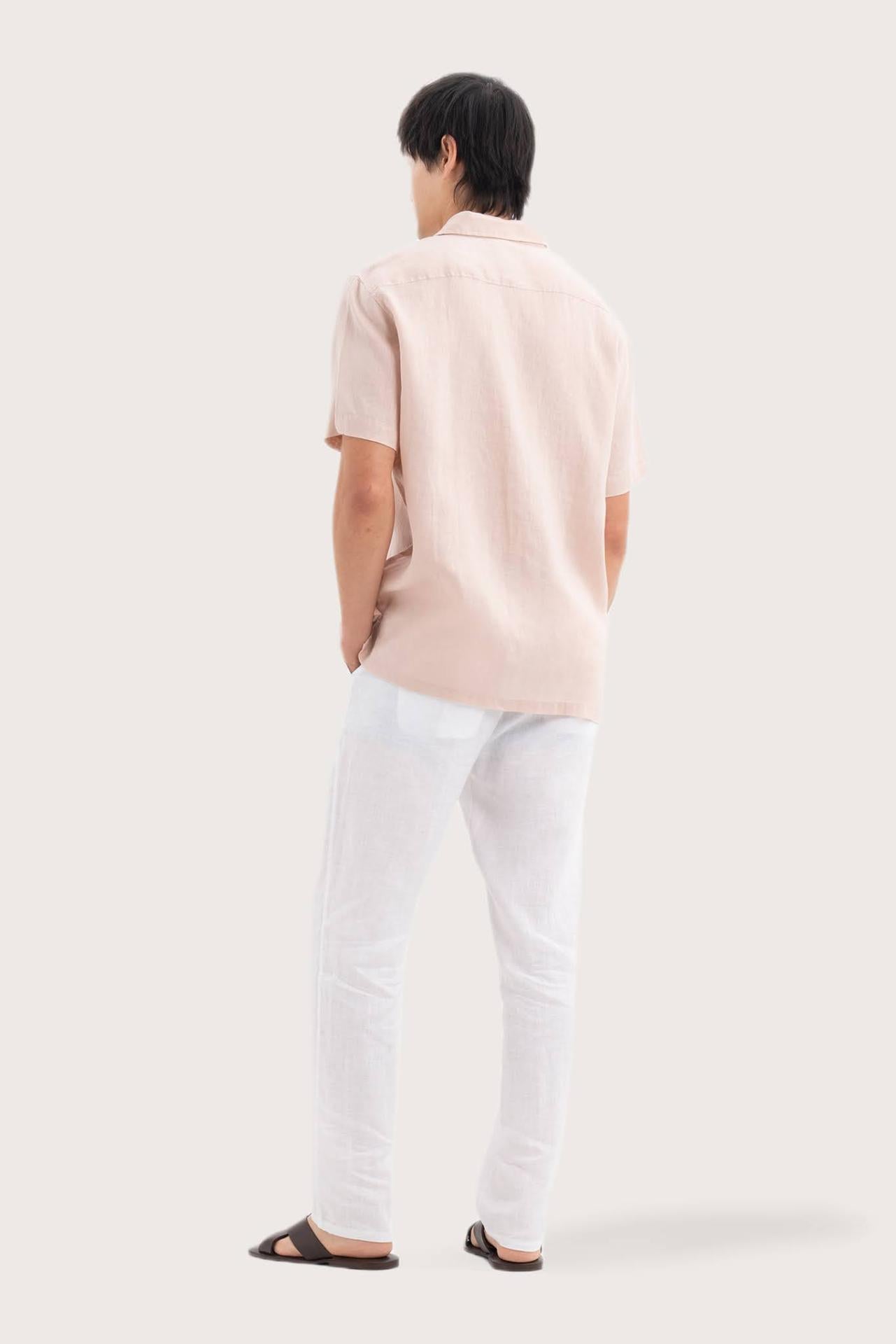 Back view of the Mori Short Sleeve Linen Shirt Light Pink showcasing its tailored finish by By The Sea Bali