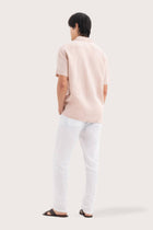 Back view of the Mori Short Sleeve Linen Shirt Light Pink showcasing its tailored finish by By The Sea Bali