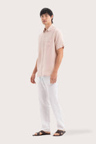 Side profile of the Mori Short Sleeve Linen Shirt Light Pink highlighting its easy, breathable fit by By The Sea Bali