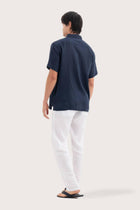 Back view of the Mori Short Sleeve Linen Shirt Navy showcasing its tailored finish by By The Sea Bali