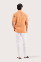 Back view of the Mori Short Sleeve Linen Shirt Orange showcasing its tailored finish by By The Sea Bali