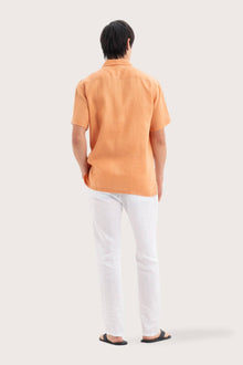 Back view of the Mori Short Sleeve Linen Shirt Orange showcasing its tailored finish by By The Sea Bali