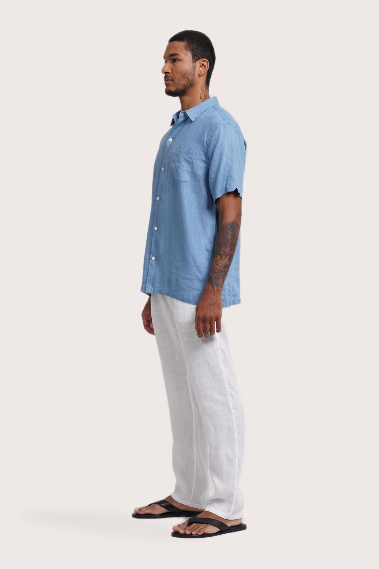 Side profile of the Mori Short Sleeve Linen Shirt Sky Blue highlighting its easy, breathable fit by By The Sea Bali