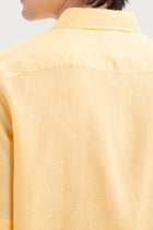 Open collar and button-front detail of the Mori Short Sleeve Linen Shirt Yellow by By The Sea Bali