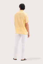 Back view of the Mori Short Sleeve Linen Shirt Yellow showcasing its tailored finish by By The Sea Bali