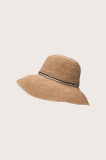 Tropical resortwear styling featuring the Morla Hat in natural and navy tones