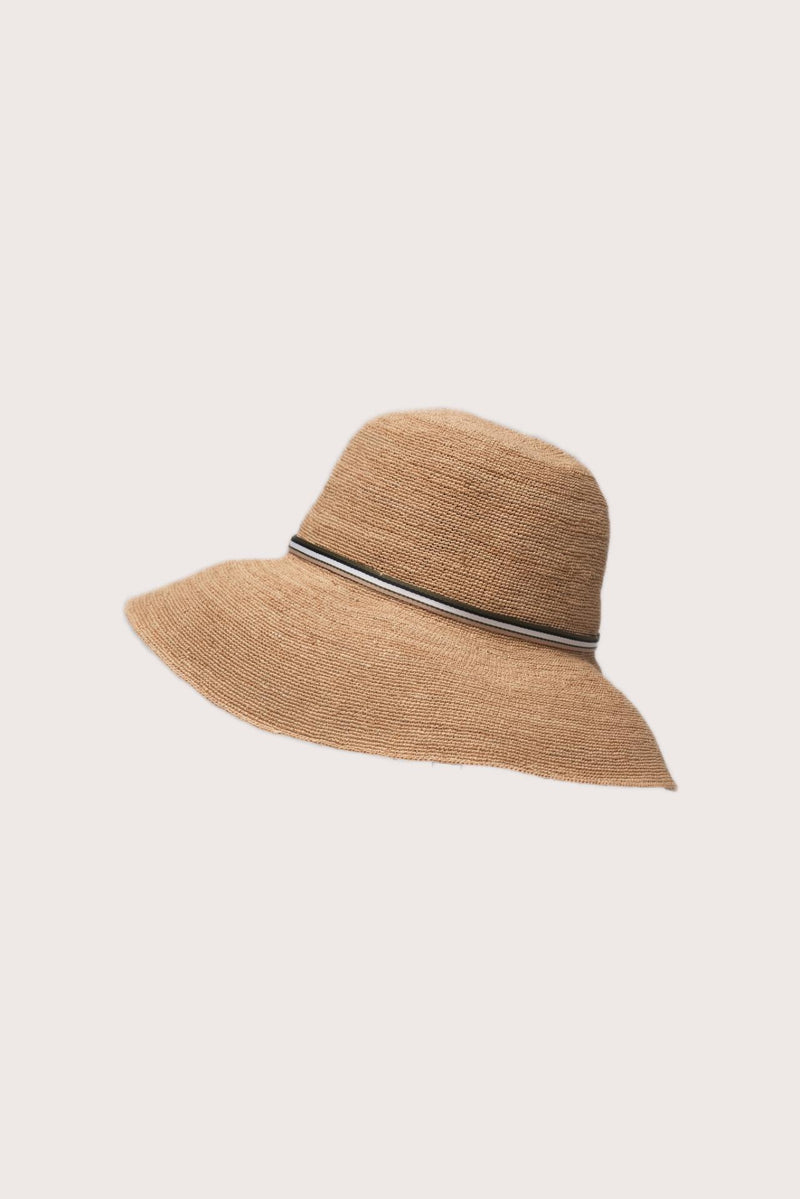 Tropical resortwear styling featuring the Morla Hat in natural and navy tones