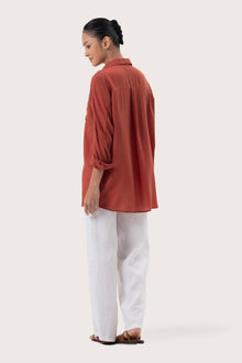 Back view of the Muara Shirt Brick highlighting the garment shape and drape.