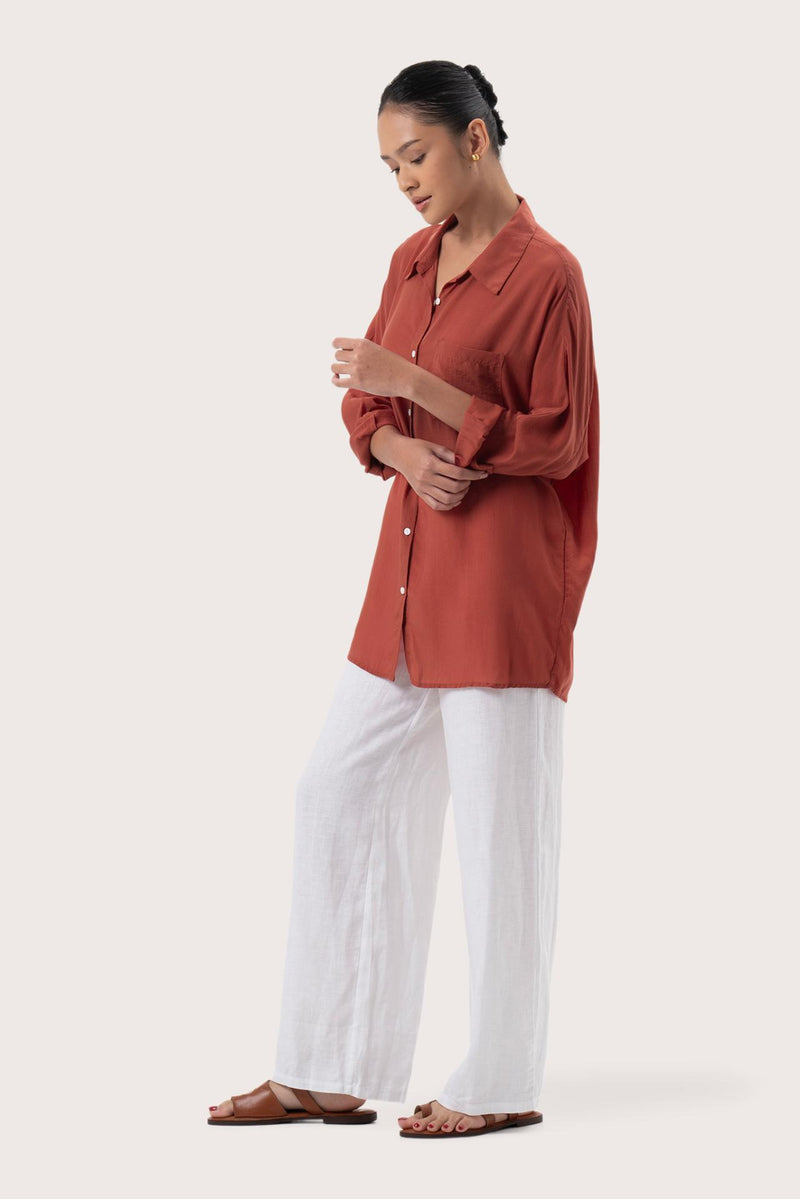 Side profile of the Muara Shirt Mustard showing its cut and natural movement.