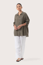 Front view of the Muara Shirt Khaki showcasing its silhouette and relaxed fit.