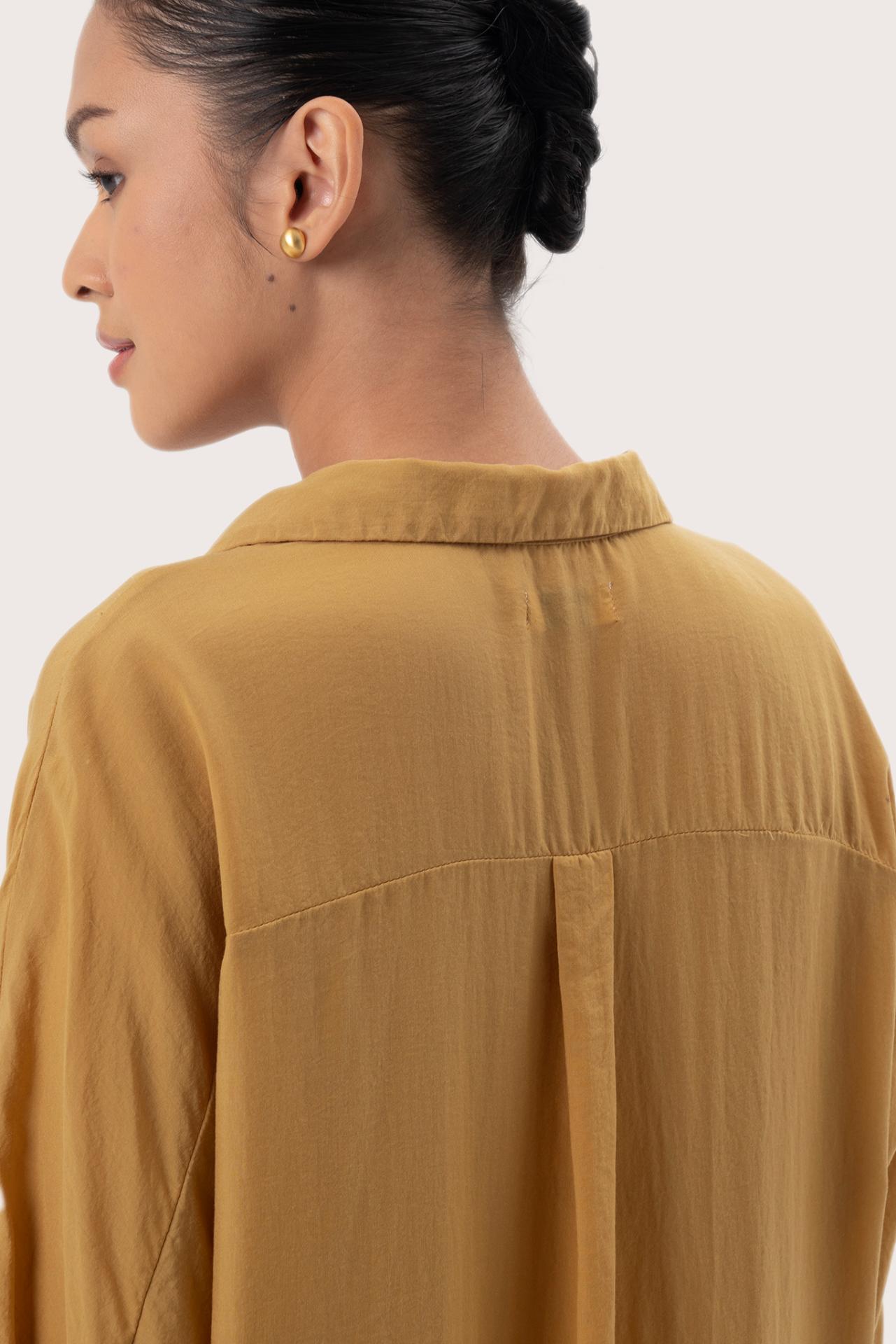Close up detail of the Muara Shirt Mustard highlighting craftsmanship and design features.