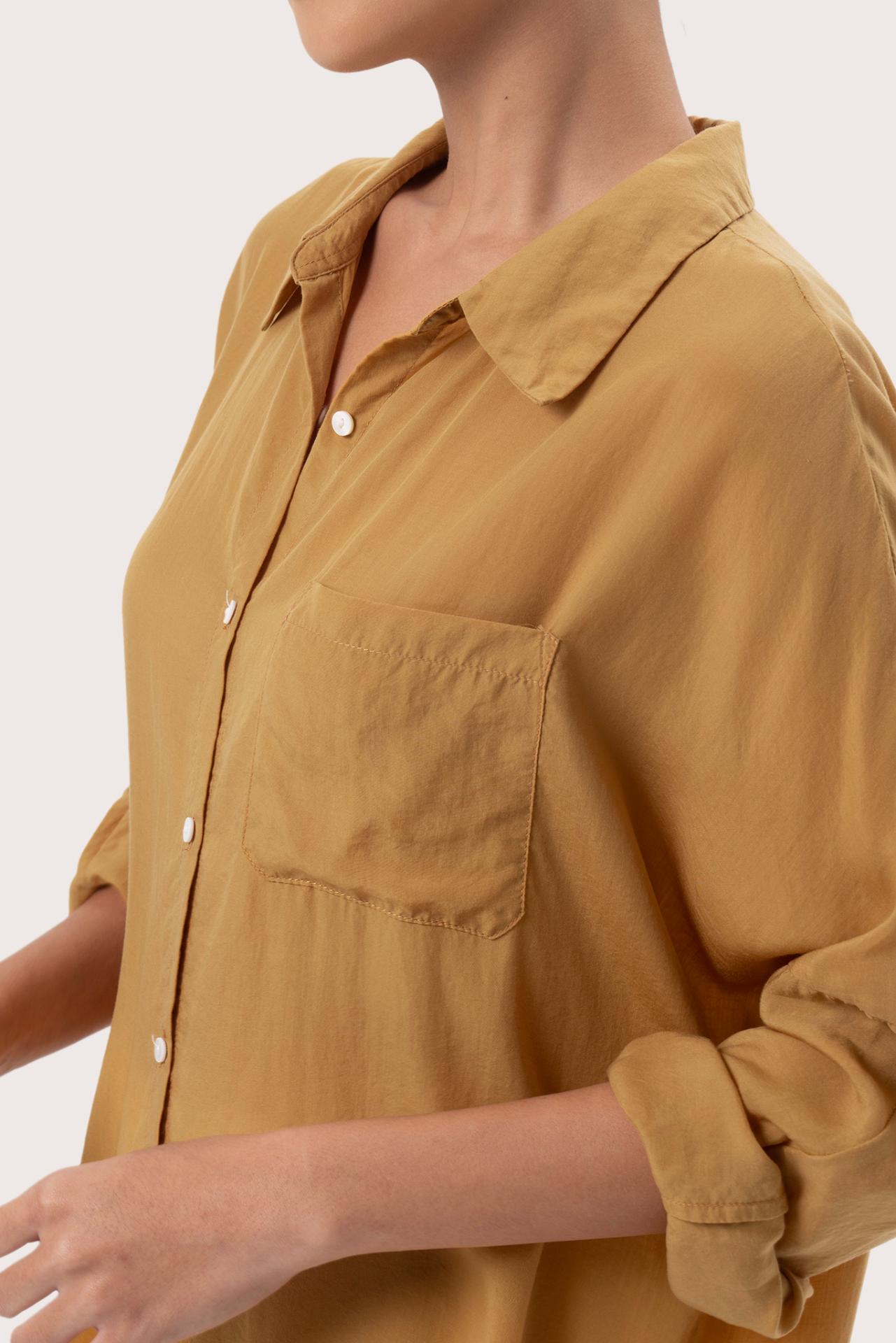 Close up detail of the Muara Shirt Mustard highlighting craftsmanship and design features.