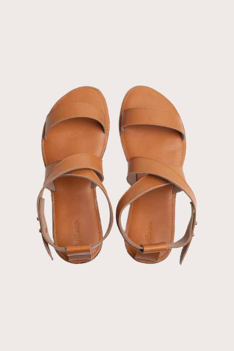 Myrtle sandal in brown shown in a global view highlighting its full silhouette and refined resort design