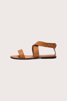 Side profile of Myrtle sandal in brown highlighting sleek and modern resort footwear silhouette
