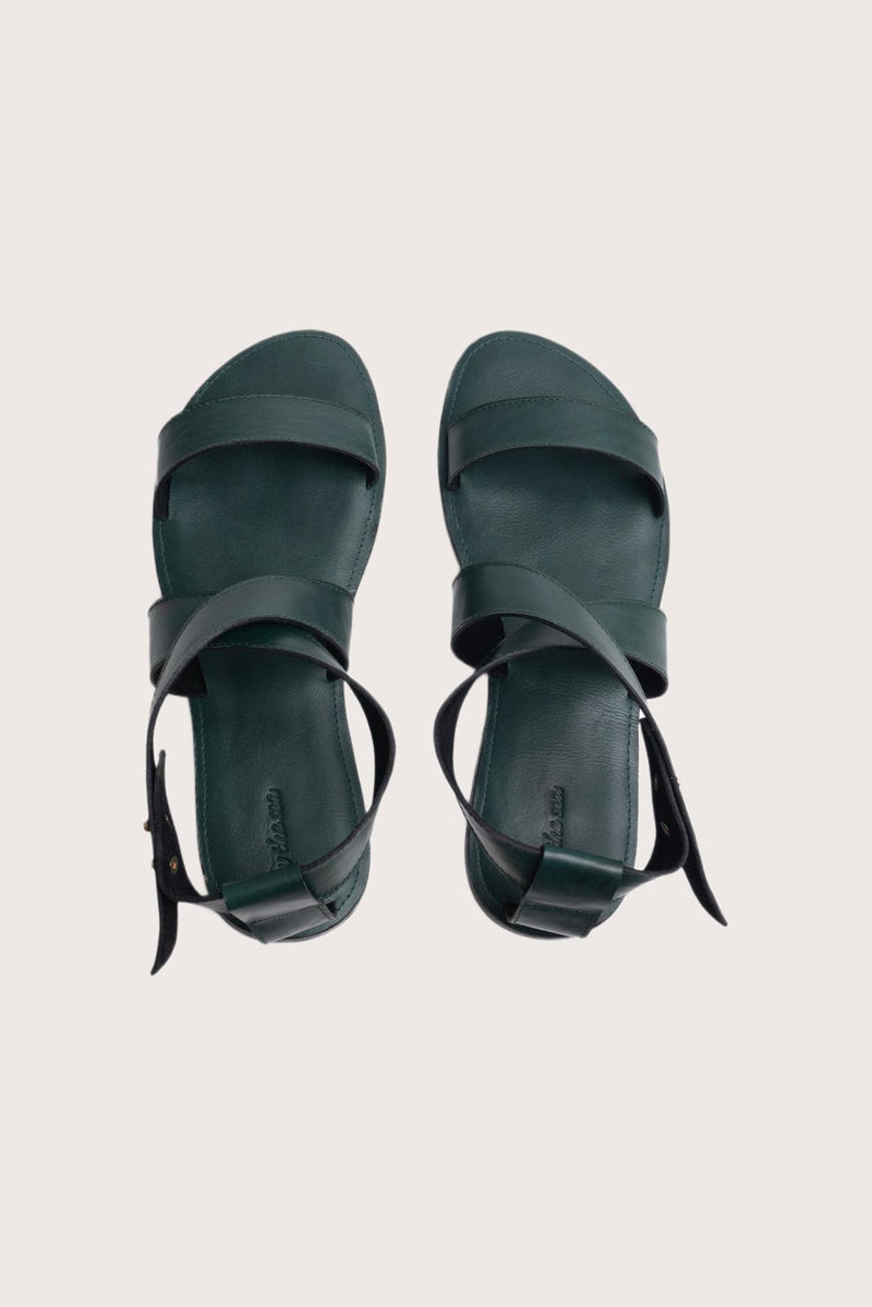 Myrtle sandal in forest green shown in a global view highlighting its full silhouette and refined resort design