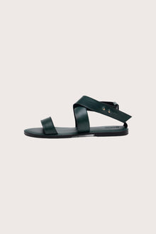Side profile of Myrtle sandal in forest green highlighting sleek and modern resort footwear silhouette