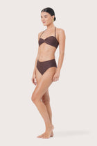 Side view of Naia Bikini Top highlighting its flattering swimwear shape