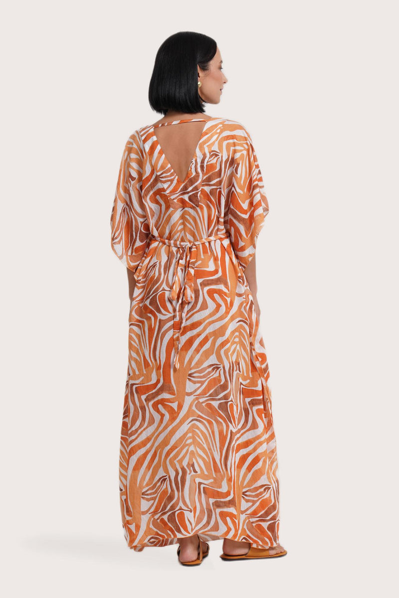 Graceful back view of the Nami Kaftan showcasing the Leopard Orange print
