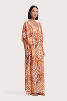 Side view of the Nami Kaftan in Leopard Orange with effortless tropical elegance