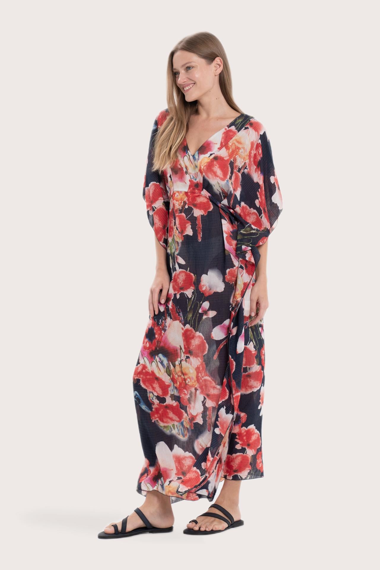 Side profile of the navy base multicolor Bougenville kaftan showcasing its elegant drape