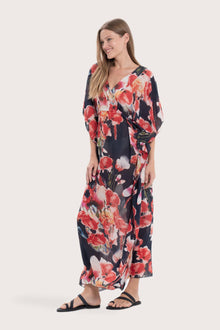 Side profile of the navy base multicolor Bougenville kaftan showcasing its elegant drape