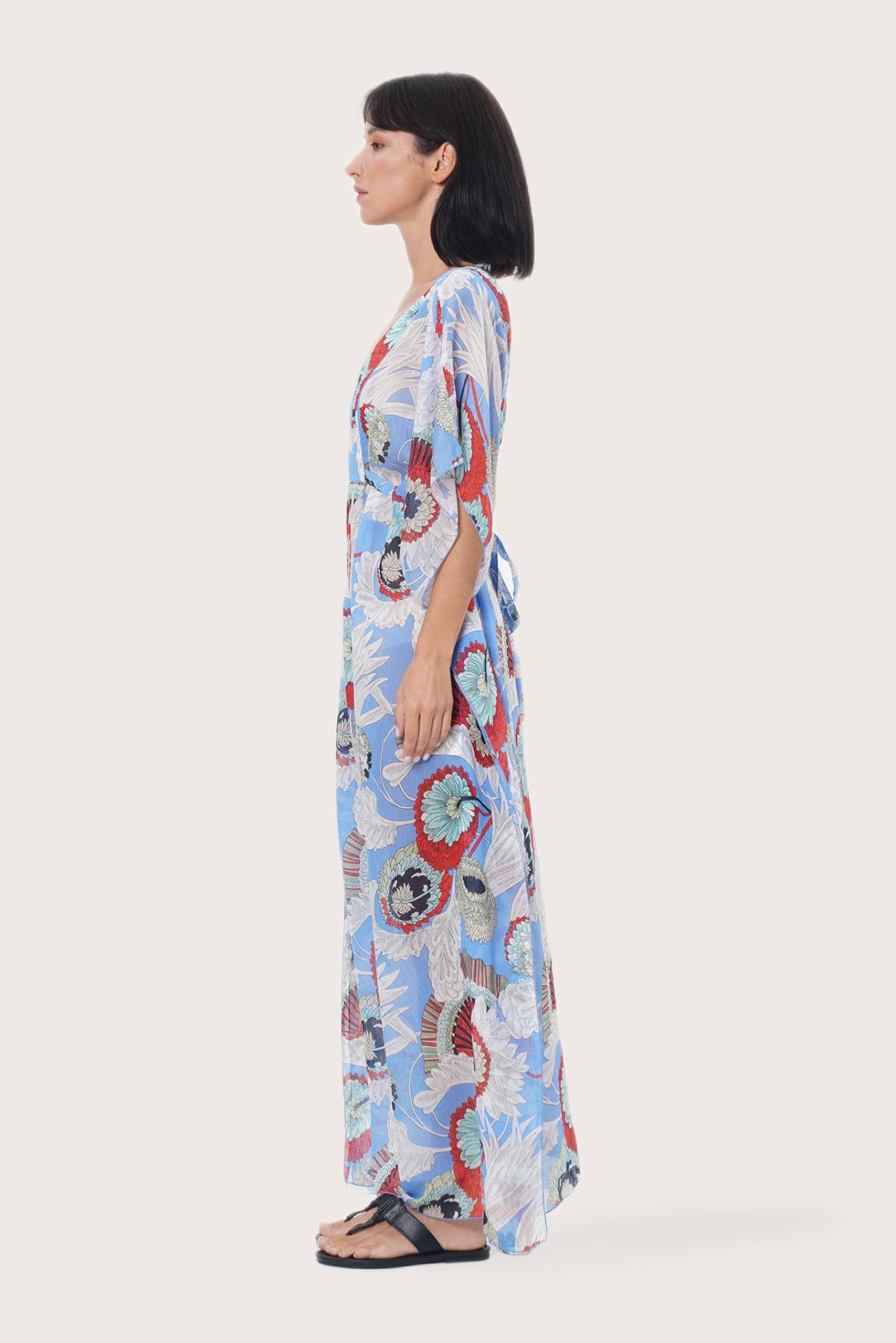 Side profile of the light blue Zinnia kaftan showcasing its elegant drape