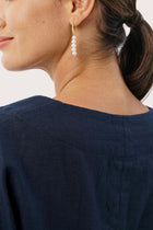Close-up of the neckline showcasing clean tailoring and refined finishing