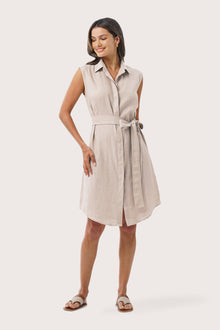 Woman wearing the Noelani Sleeveless Linen Dress Beige designed for effortless resortwear and tropical living by By The Sea Bali