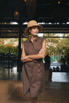 Woman wearing the Noelani Sleeveless Linen Dress Navy designed for effortless resortwear and tropical living by By The Sea Bali