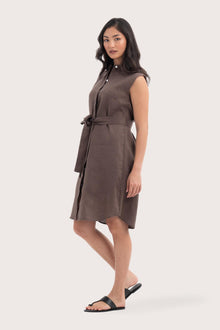 Side profile of the Noelani Sleeveless Linen Dress Dark Brown showing its cut and natural movement