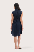 Back view of the Noelani Sleeveless Linen Dress Navy highlighting the garment shape and drape