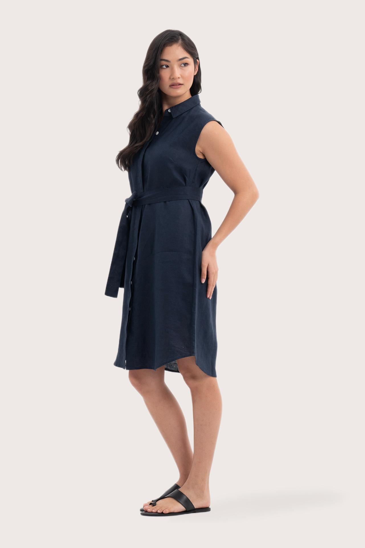 Side profile of the Noelani Sleeveless Linen Dress Navy showing its cut and natural movement
