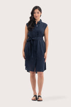 Woman wearing the Noelani Sleeveless Linen Dress Navy designed for effortless resortwear and tropical living by By The Sea Bali