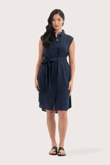 Woman wearing the Noelani Sleeveless Linen Dress Navy designed for effortless resortwear and tropical living by By The Sea Bali