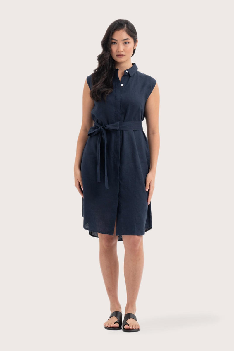Woman wearing the Noelani Sleeveless Linen Dress Navy designed for effortless resortwear and tropical living by By The Sea Bali