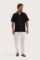 profile of the black linen shirt showcasing its effortless drape and comfortable fit