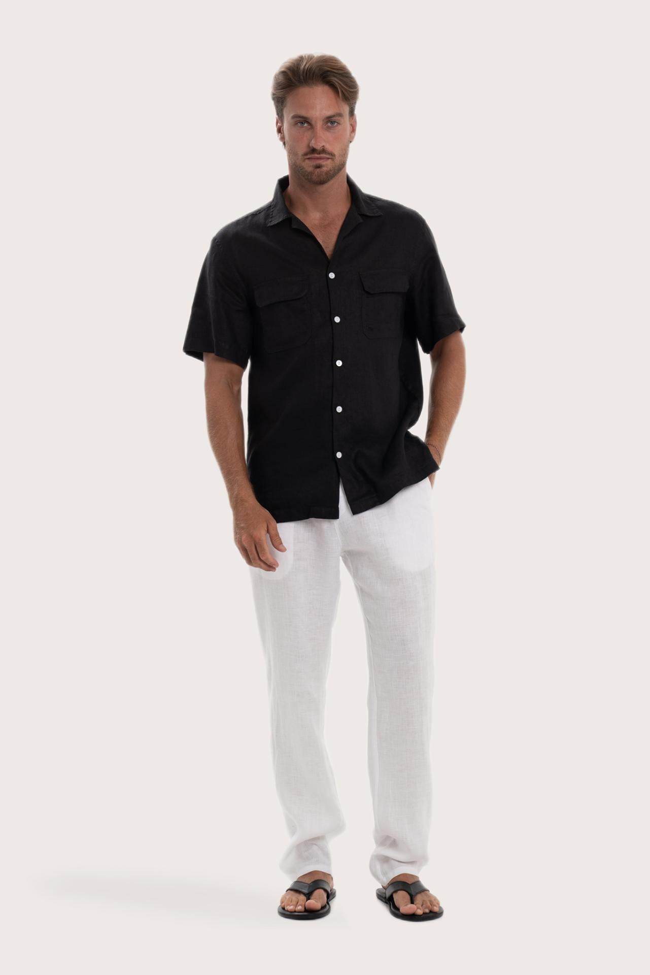 Model wearing the black linen Odyssey shirt by By The Sea Bali